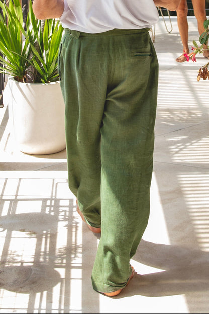 Baggy green linen pants being worn in Bali on the balcony at home 