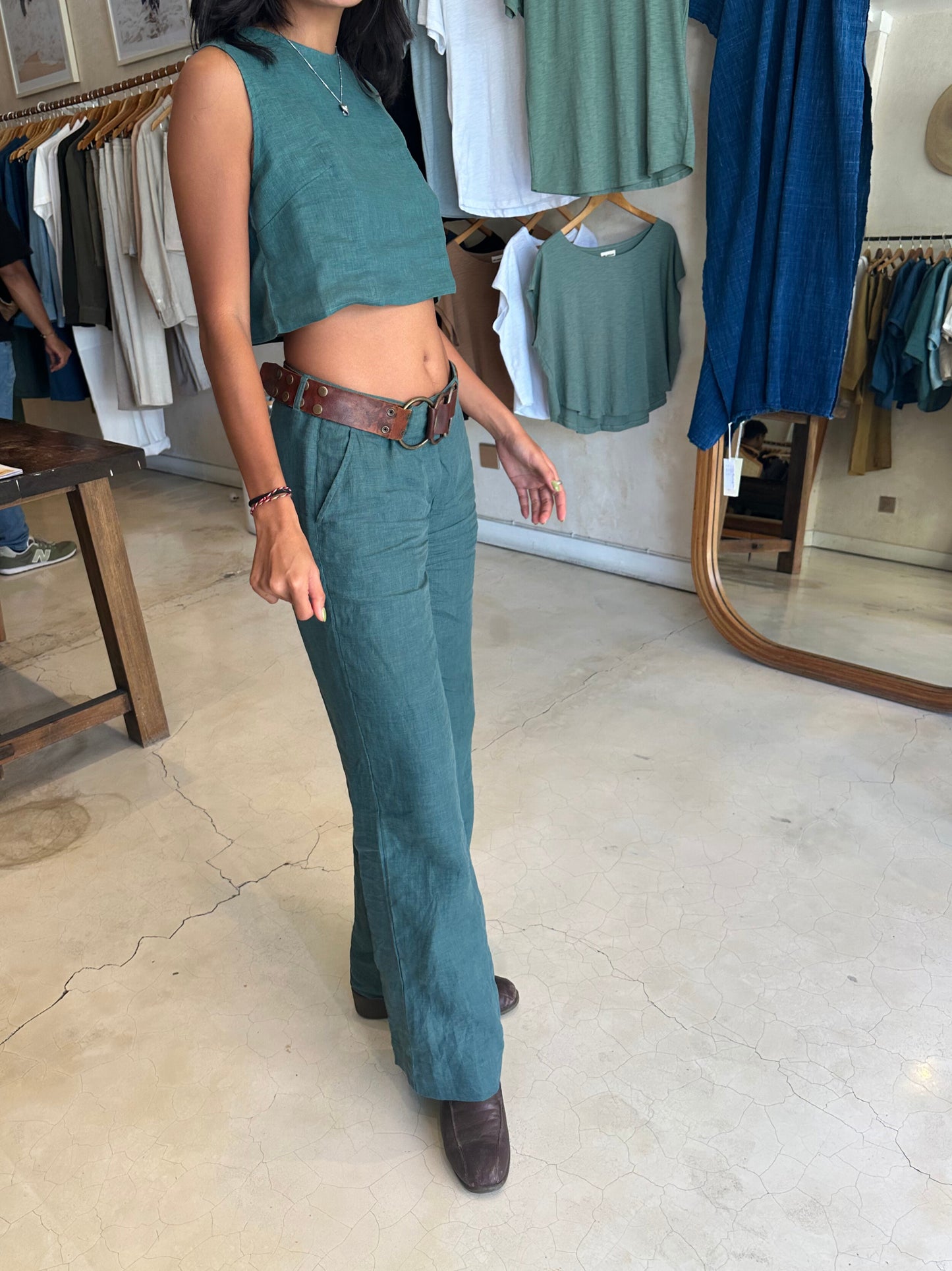Person wearing a teal outfit in Lovejoy Canggu clothing store