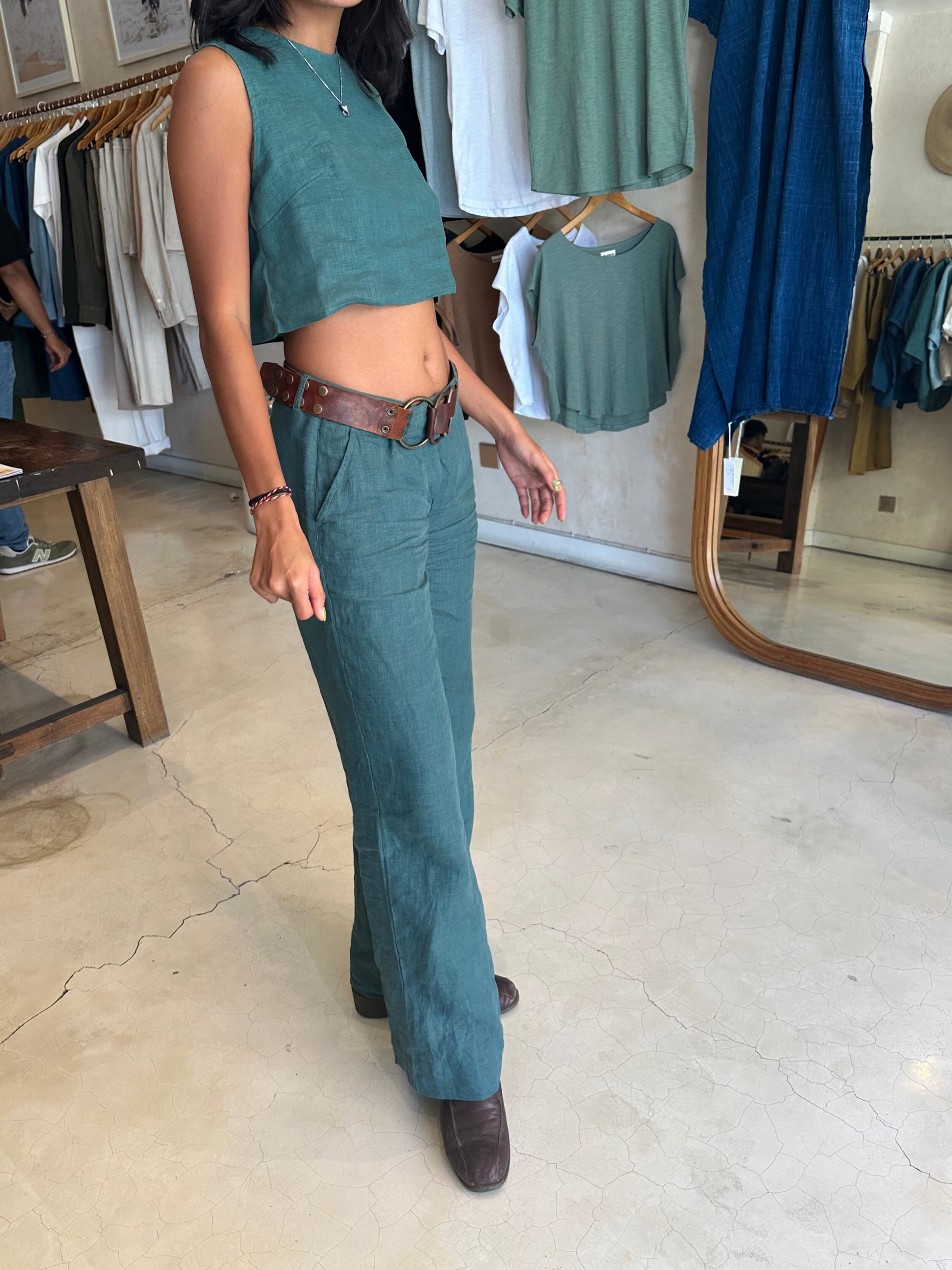 Person wearing a teal outfit in Lovejoy Canggu clothing store